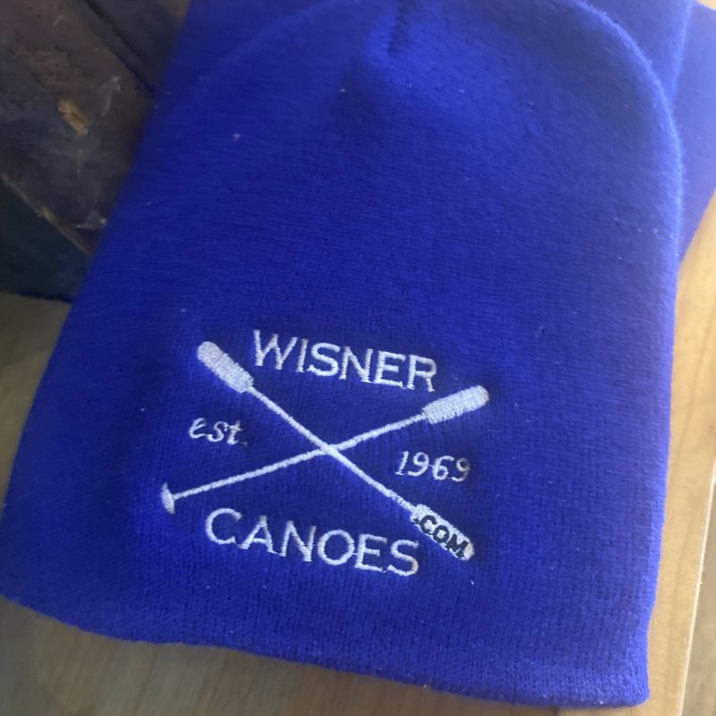 Blue beanie with 'Wisner Canoes est. 1969' and crossed paddles logo.